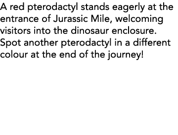 A red pterodactyl stands eagerly at the entrance of Jurassic Mile, welcoming visitors into the dinosaur enclosure  Sp   